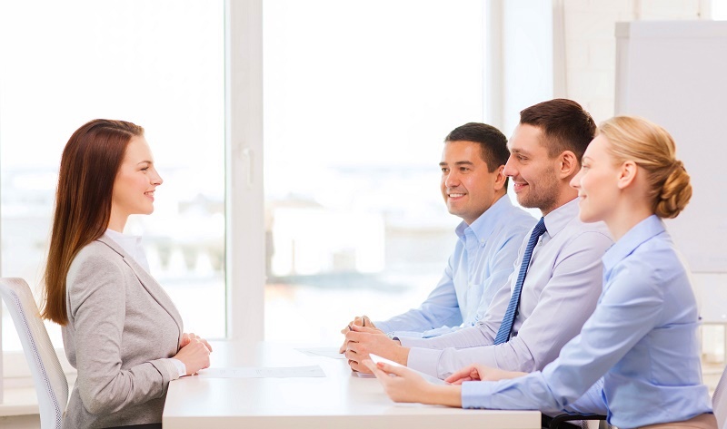 smiling businesswoman at interview in office