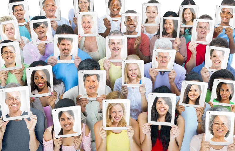Multi-ethnic casual people holding the tablet