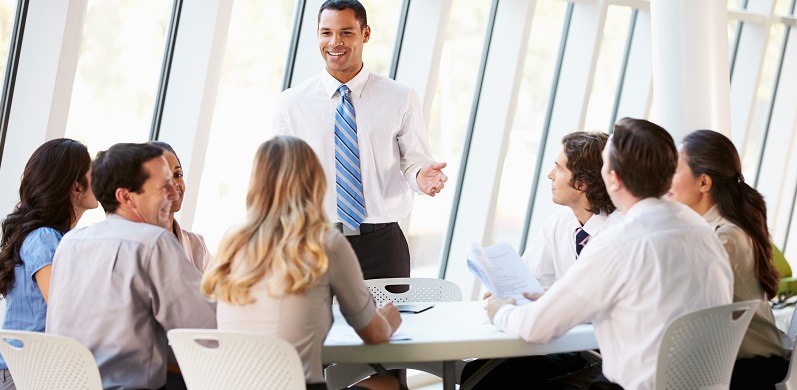 Business People Having Board Meeting In Modern Office