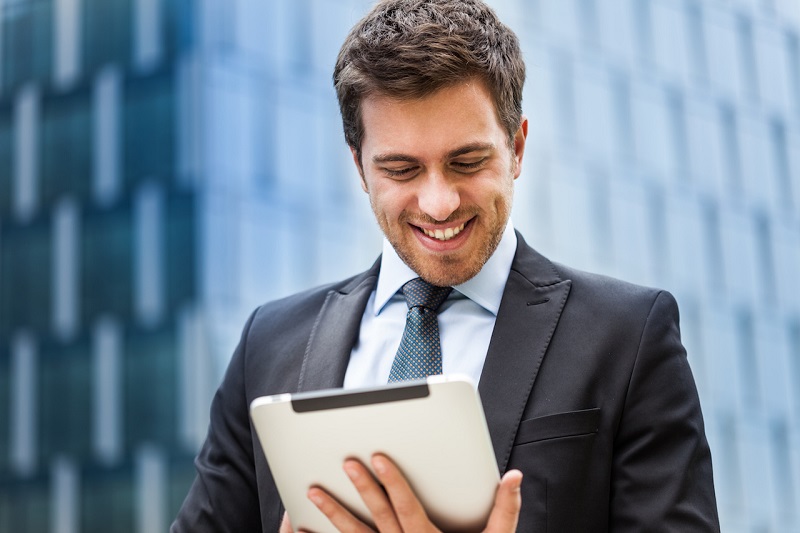 businessman-reading-ipad