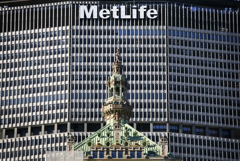 FILE - In this April 16, 2009, file photo, the MetLife skyscraper overlooks another building in New York. MetLife has won a major legal challenge to the government’s policy for preventing another financial crisis, as a federal judge on Wednesday, March 30, 2016, tossed out its designation by regulators as a potential threat to the financial system. MetLife Inc., the largest U.S. insurance company by assets, took the government to court more than a year ago to appeal its labeling by the Financial Stability Oversight Council as “systemically important.” (AP Photo/Mark Lennihan, File)