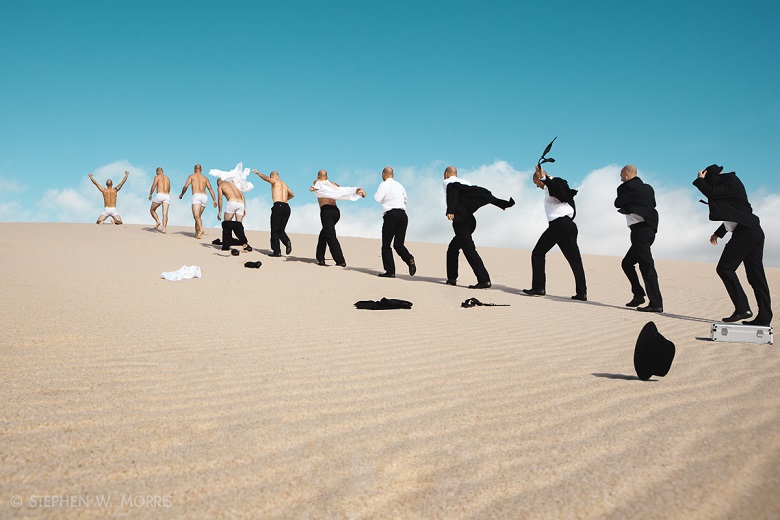 Businessman Undressing in Desert