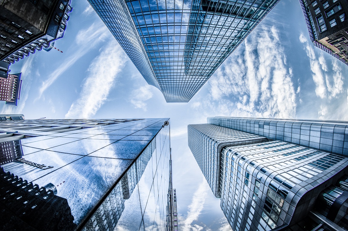 low-angle-photo-of-four-high-rise-curtain-wall-buildings