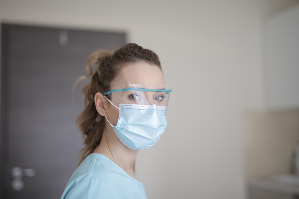 woman-in-blue-shirt-wearing-face-mask,covid-19
