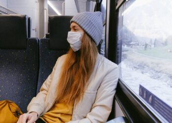 woman-in-gray-knit-cap-and-beige-coat-insurancedaily