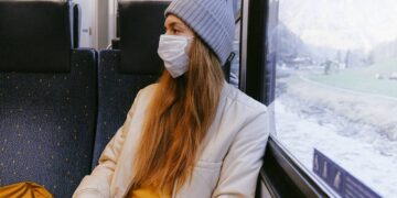 woman-in-gray-knit-cap-and-beige-coat-insurancedaily
