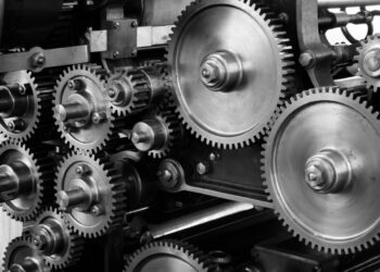 gray-scale-photo-of-gears-insurancedaily