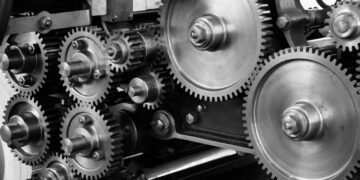 gray-scale-photo-of-gears-insurancedaily
