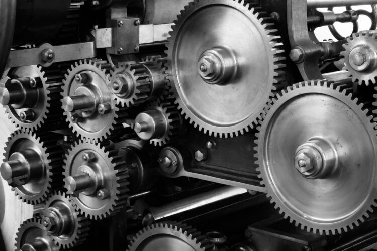 gray-scale-photo-of-gears-insurancedaily