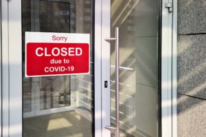 Business Center Closed Due To Covid-19, Sign With Sorry In Door