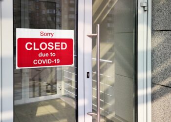 Business Center Closed Due To Covid-19, Sign With Sorry In Door