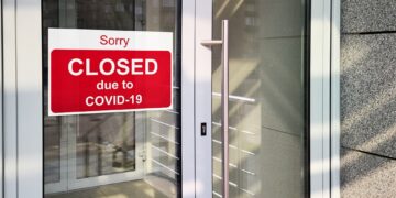 Business Center Closed Due To Covid-19, Sign With Sorry In Door