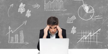 young-business-man-with-laptop-brainstorming-business-concept-sketch-draw