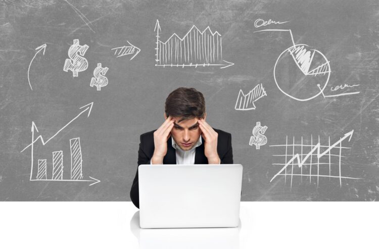 young-business-man-with-laptop-brainstorming-business-concept-sketch-draw