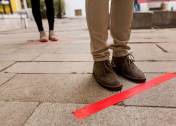 woman-queue-outdoors-with-tape