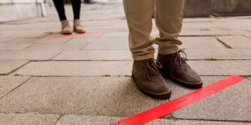 woman-queue-outdoors-with-tape