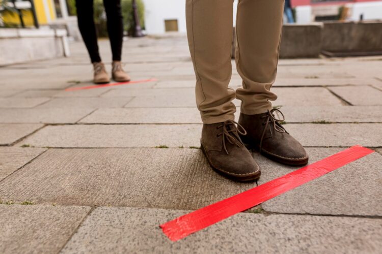woman-queue-outdoors-with-tape