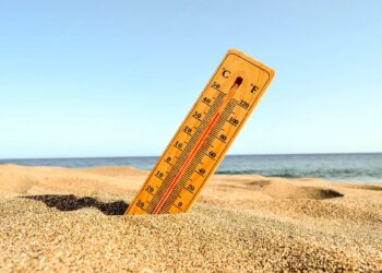 closeup-shot-thermometer-beach-sand