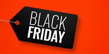 Black friday tag on red banner with text space