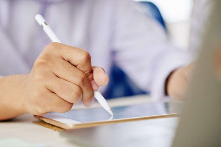 man-working-tablet-with-stylus