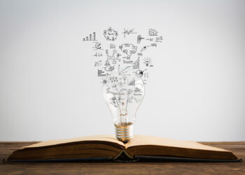Book and light bulb of business concept