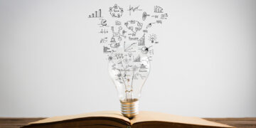 Book and light bulb of business concept