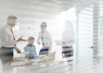 Four office workers having talk about financial rate of the company latest business project