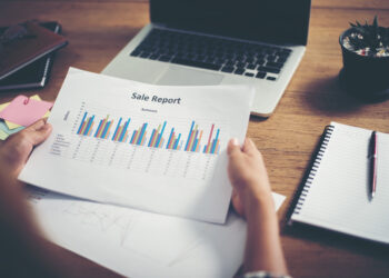 young  Businessman woman hands reviewing analyzing financial data chart.