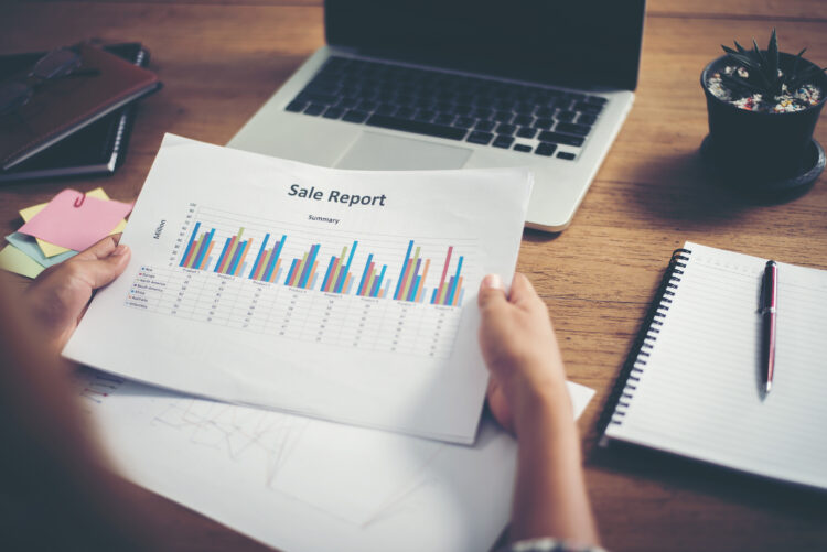 young  Businessman woman hands reviewing analyzing financial data chart.