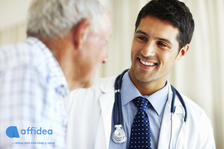 Portrait of handsome doctor talking with senior patient