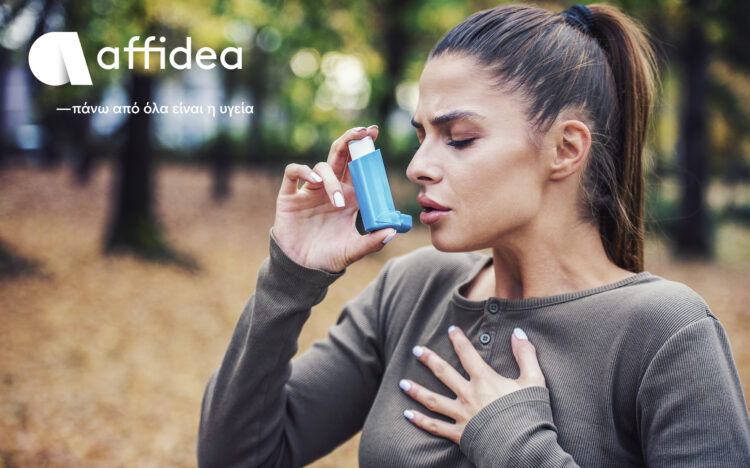 Woman using asthma inhaler