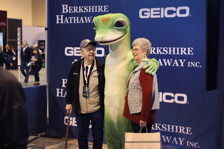 Shareholders pose for a picture with a Geico mascot at the Berkshire Hathaway annual shareholder's meeting on April 30, 2022, in Omaha, Nebraska. This is the first time the annual shareholders event has been held since 2019 due to the COVID-19 pandemic. (Scott Olson/Getty Images/TNS)