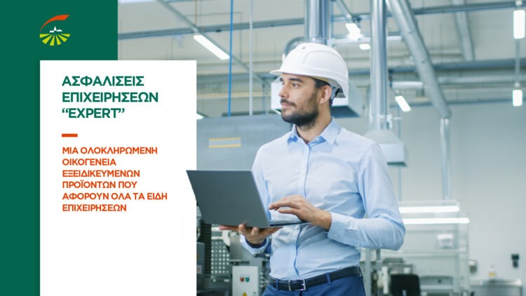 Chief Engineer in the Hard Hat Walks Through Light Modern Factory While Holding Laptop. Successful, Handsome Man in Modern Industrial Environment.